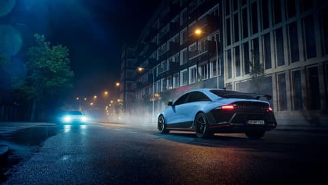 IONIQ 6 N illuminated at night, parked on a city street, highlighting its sophisticated design.