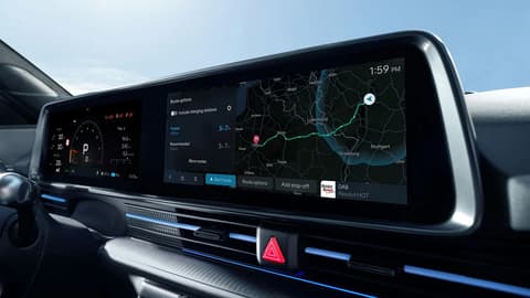 IONIQ 6 N interior display showing navigation map and digital driver information on the wide curved infotainment screen.