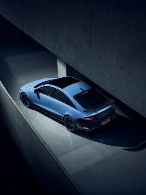 Top-down view of Hyundai IONIQ 6N on a curved ramp, highlighting streamlined roof and rear wing.