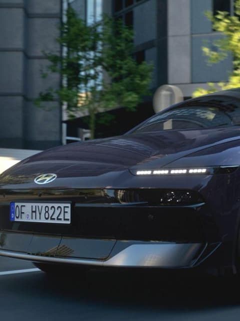 Video of the Hyundai IONIQ 6 electric sedan driving on city streets. 