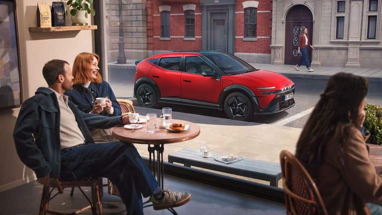 Hyundai IONIQ 3 electric vehicle showcased in a modern lifestyle setting.