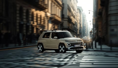 Hyundai INSTER, малък електрически автомобил, който завива на ъгъл в градска среда.