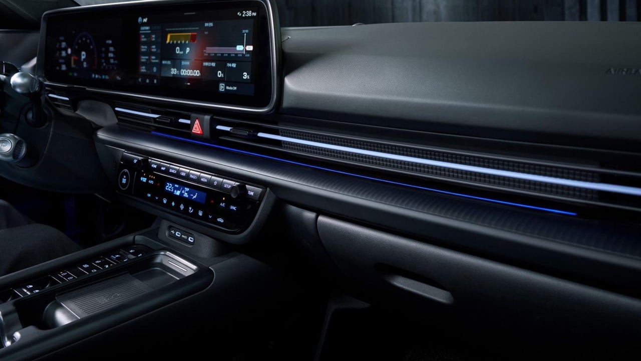 Close-up of the dashboard and ambient lighting system inside the Hyundai IONIQ 6 N, highlighting its sleek design.