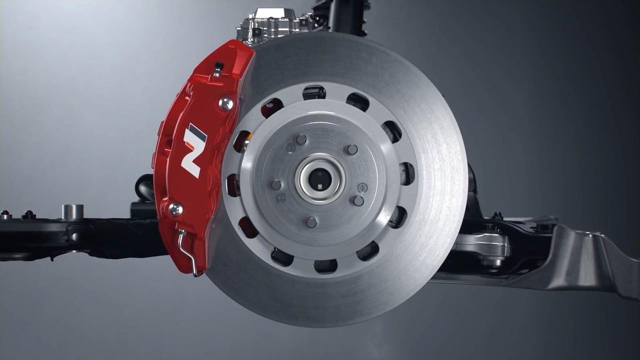 Close-up of a high-performance brake assembly on a Hyundai IONIQ 6 N showcasing detailed engineering.