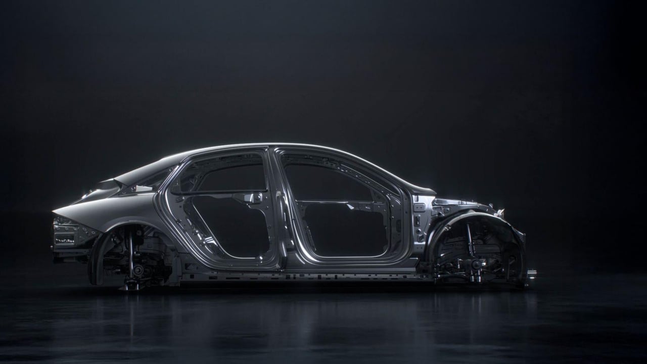 Side view of the Hyundai IONIQ 6 N's aerodynamic chassis construction highlighted against a dark background.