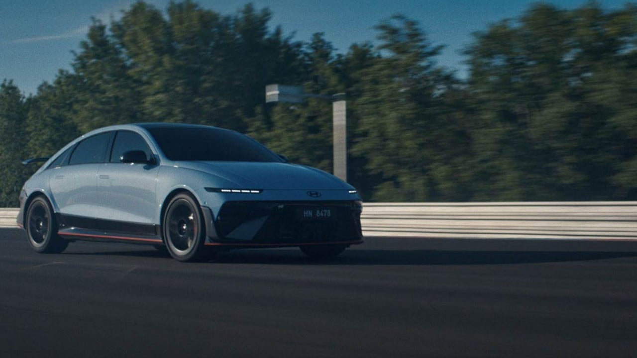 Action shot of the Hyundai IONIQ 6 N on a racetrack, capturing its sporty presence and speed in motion.