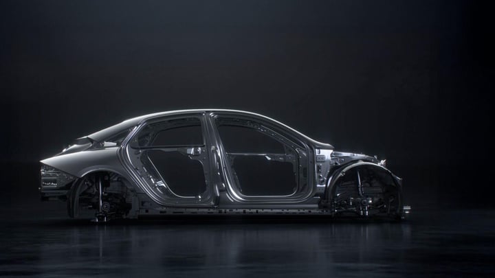 Side view of the Hyundai IONIQ 6 N's aerodynamic chassis construction highlighted against a dark background.